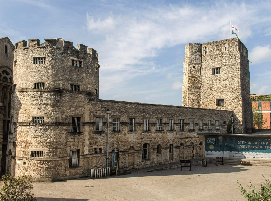 Historic Oxford Castle with a sunny sky, showcasing medieval architecture and ancient stone walls, England heritage site